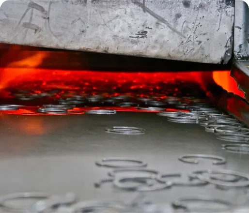 Metal parts coming out of the heat treatment furnace